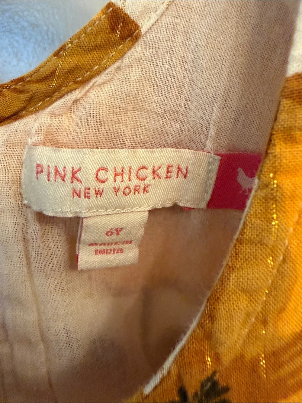 Pink Chicken White Dress with Bold Yellow Floral Print